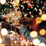 Three people toasting during Christmas event