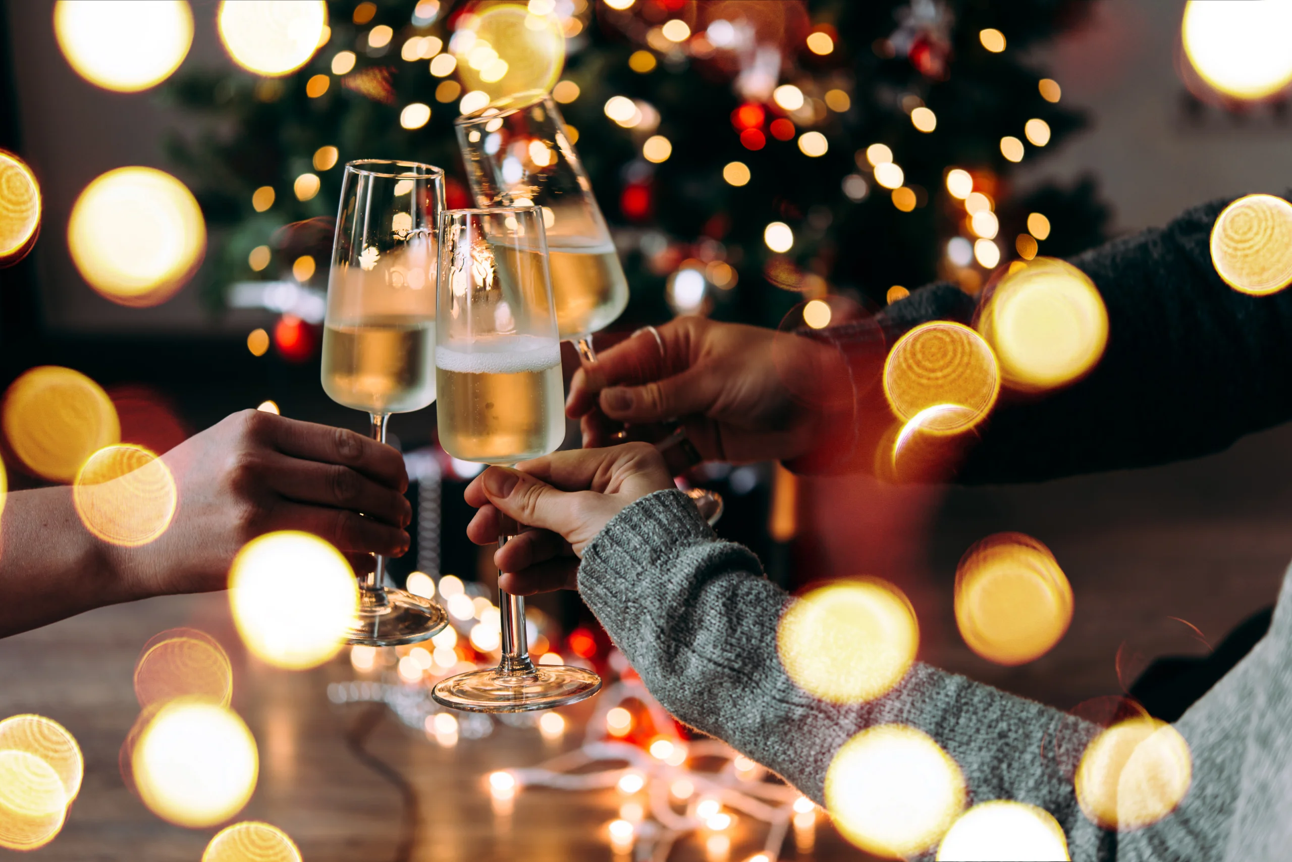 Three people toasting during Christmas event