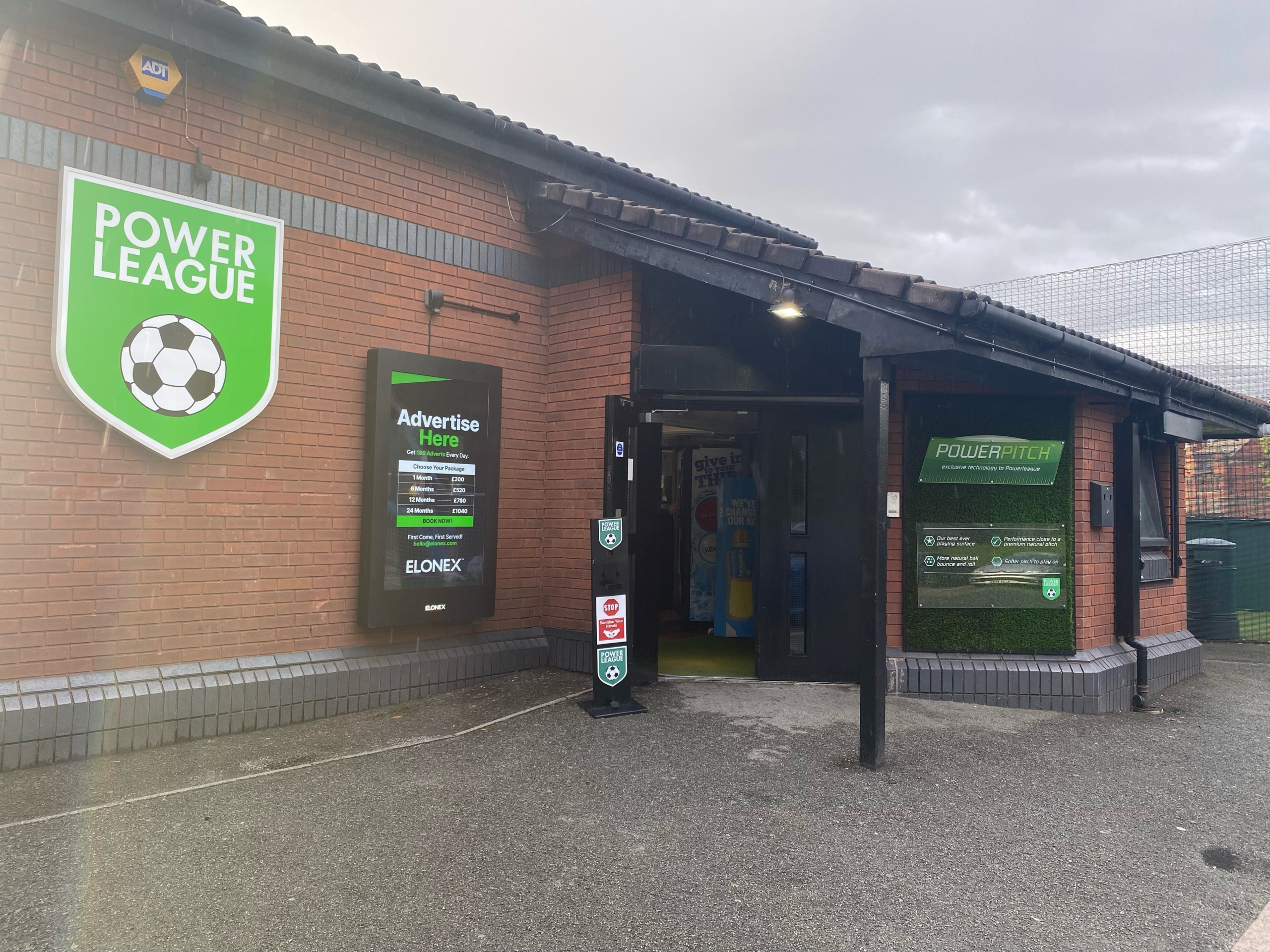 Entrance to a sports complex with a sign reading 